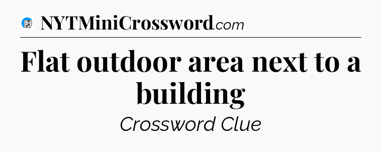 Flat outdoor area next to a building Crossword Clue