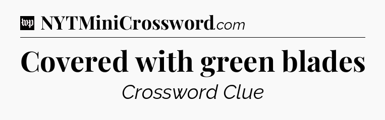 Covered with green blades Crossword Clue
