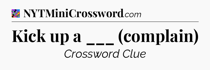 Kick up a ___ (complain) Crossword Clue