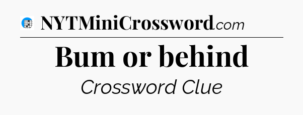 Bum or behind Crossword Clue