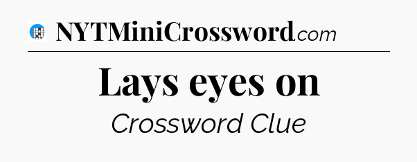 Lays eyes on Crossword Clue