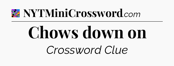 Chows down on Crossword Clue