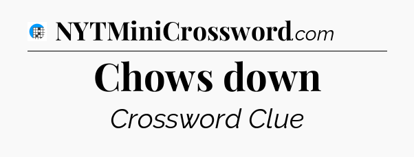 Chows down Crossword Clue