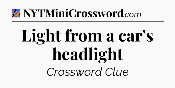 Light from a car's headlight Crossword Clue