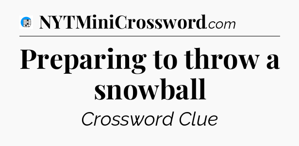 Preparing to throw a snowball Crossword Clue